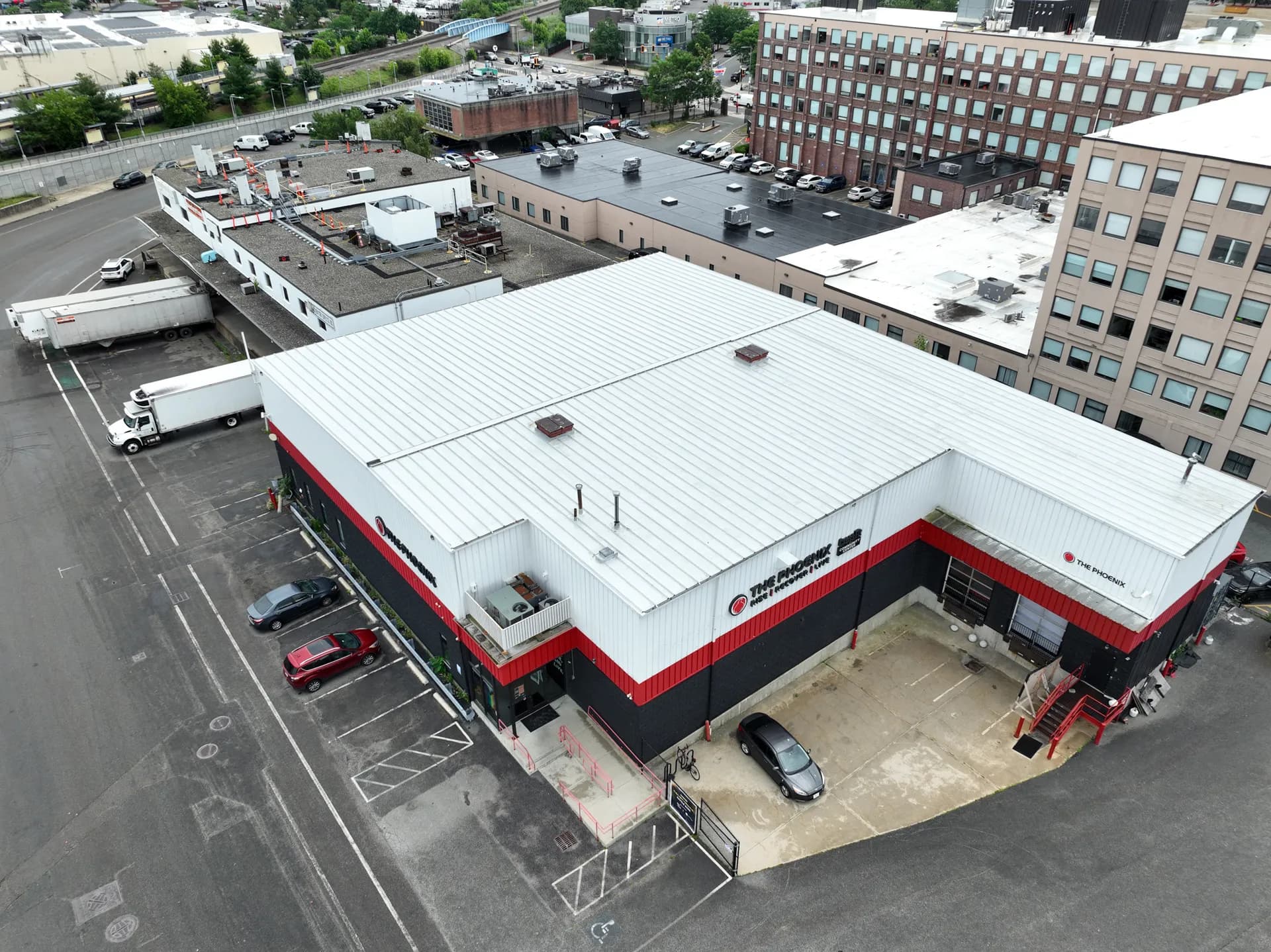 Aerial view of a large commercial flat roof with rooftop equipment.