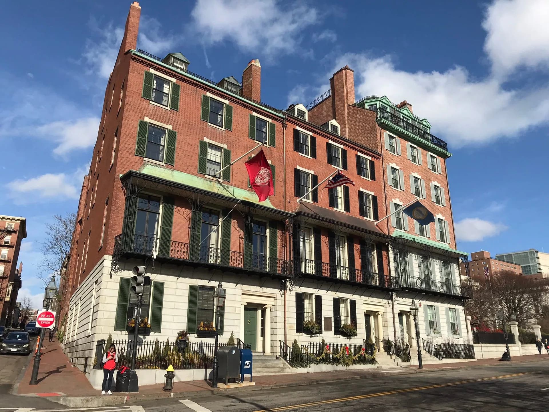 The George Francis Parkman House on Beacon Street - brick facade with iron balconies, copper trim, and flag poles.